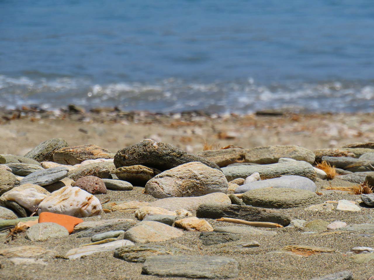 Admiring the colored pebbles of Megali Ammos Kanalas beach
